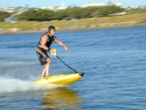 Men riding a jet board